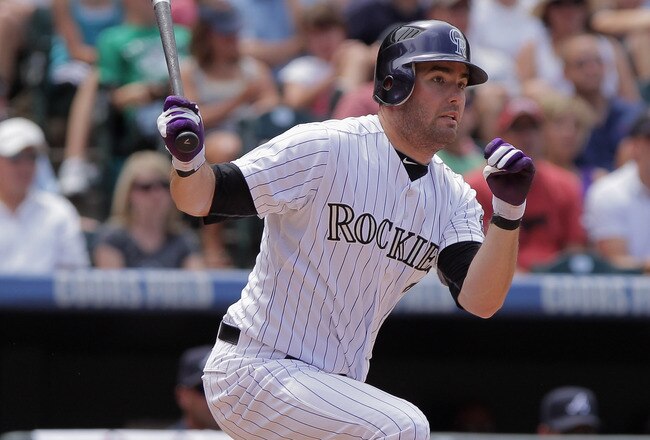 DENVER, CO - JULY 21:  Seth Smith #7 of the Colorado Rockies takes an at bat against the Atlanta Braves at Coors Field on July 21, 2011 in Denver, Colorado.  (Photo by Doug Pensinger/Getty Images)