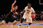 NEW YORK, NY - DECEMBER 10: Ashton Gibbs #12 of the Pittsburgh Panthers dribbles past Cezar Guerrero #1 of the Oklahoma State Cowboys at Madison Square Garden on December 10, 2011 in New York City.  (Photo by Chris Trotman/Getty Images)