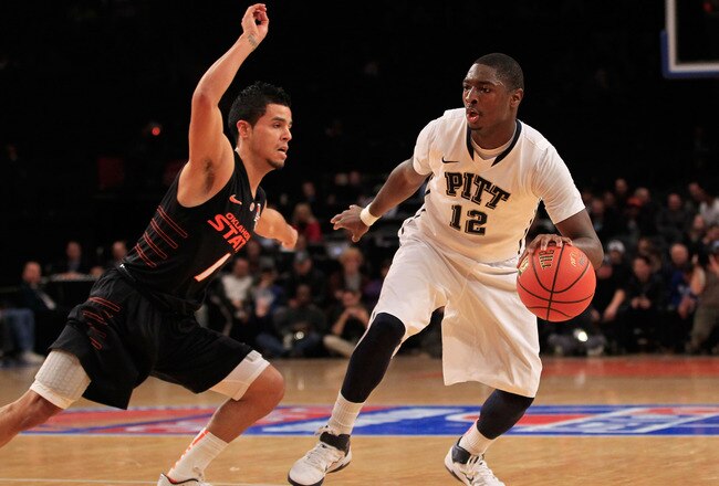 NEW YORK, NY - DECEMBER 10: Ashton Gibbs #12 of the Pittsburgh Panthers dribbles past Cezar Guerrero #1 of the Oklahoma State Cowboys at Madison Square Garden on December 10, 2011 in New York City.  (Photo by Chris Trotman/Getty Images)