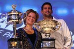 MELBOURNE, AUSTRALIA - JANUARY 13:  Defending champions Kim Clijsters of Belgian and Novak Djokovic of Serbia pose with the Championship trophies at the Official draw ahead of the 2012 Australian Open at Rod Laver Arena on January 13, 2012 in Melbourne, Australia.  (Photo by Mark Dadswell/Getty Images)