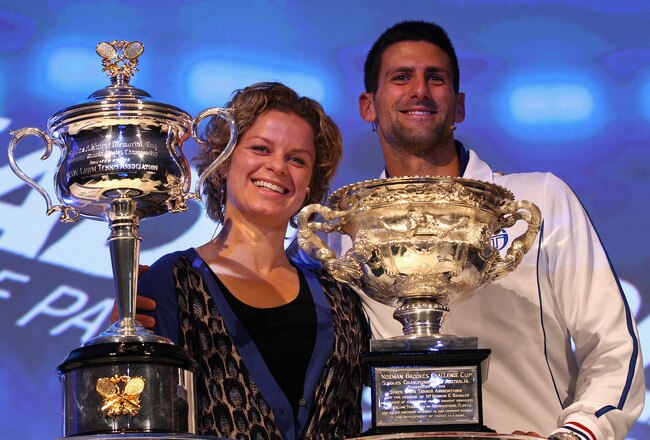 MELBOURNE, AUSTRALIA - JANUARY 13:  Defending champions Kim Clijsters of Belgian and Novak Djokovic of Serbia pose with the Championship trophies at the Official draw ahead of the 2012 Australian Open at Rod Laver Arena on January 13, 2012 in Melbourne, Australia.  (Photo by Mark Dadswell/Getty Images)
