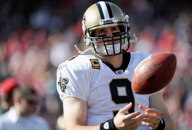 SAN FRANCISCO, CA - JANUARY 14:  Drew Brees #9 of the New Orleans Saints warms up before his team takes on the San Francisco 49ers in the NFC Divisional playoff game at Candlestick Park on January 14, 2012 in San Francisco, California.  (Photo by Thearon W. Henderson/Getty Images)