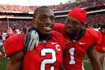 ATHENS, GA - NOVEMBER 19:  Brandon Boykin #2 and Branden Smith #1 of the Georgia Bulldogs celebrate after their 19-10 win over the Kentucky Wildcats at Sanford Stadium on November 19, 2011 in Athens, Georgia.  (Photo by Kevin C. Cox/Getty Images)