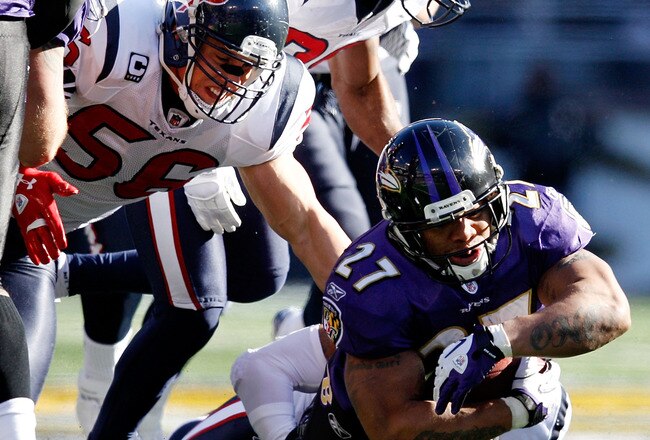 BALTIMORE, MD - JANUARY 15:  Ray Rice #27 of the Baltimore Ravens is tackeled by  Glover Quin #29 of the Houston Texans  during the first quarter of the AFC Divisional playoff game at M&T Bank Stadium on January 15, 2012 in Baltimore, Maryland.  (Photo by Rob Carr/Getty Images)