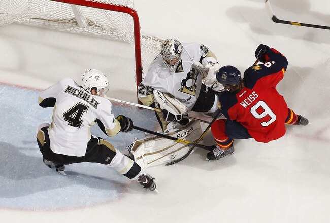 SUNRISE, FL - JANUARY 13: Zbynek Michalek #4 assists goaltender Marc-Andre Fleury #29 of the Pittsburgh Penguins to defend the net against a shot by Stephen Weiss #9 of the Florida Panthers on January 13, 2012 at the BankAtlantic Center in Sunrise, Florida.  The Penguins defeated the Panthers 4-1. (Photo by Joel Auerbach/Getty Images)