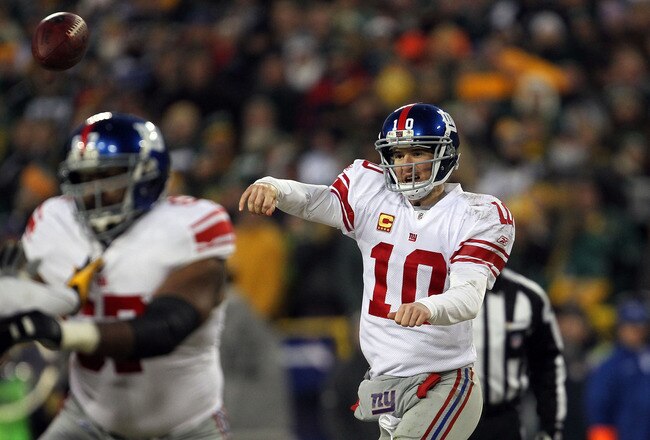 GREEN BAY, WI - JANUARY 15:  Eli Manning #10 of the New York Giants passes against the Green Bay Packers during their NFC Divisional playoff game at Lambeau Field on January 15, 2012 in Green Bay, Wisconsin.  (Photo by Jonathan Daniel/Getty Images)