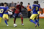 HARRISON, NJ - OCTOBER 11: Edson Buddle #17 of the U.S. dribbles by Edison Mendez #8 of Ecuador during their match at Red Bull Arena on October 11, 2011 in Harrison, New Jersey. (Photo by Jeff Zelevansky/Getty Images)