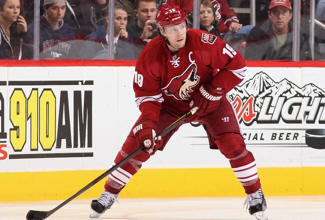 GLENDALE, AZ - DECEMBER 28:  Shane Doan #19 of the Phoenix Coyotes handles the puck during the NHL game against the Boston Bruins at Jobing.com Arena on December 28, 2011 in Glendale, Arizona. The Bruins defeated the Coyotes 2-1 in overtime.  (Photo by Christian Petersen/Getty Images)