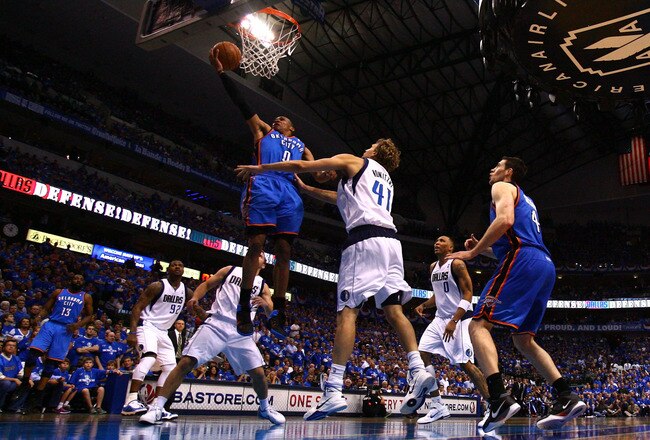DALLAS, TX - MAY 25:  Russell Westbrook #0 of the Oklahoma City Thunder goes up for a shot against Dirk Nowitzki #41 of the Dallas Mavericks in the second half in Game Five of the Western Conference Finals during the 2011 NBA Playoffs at American Airlines Center on May 25, 2011 in Dallas, Texas. NOTE TO USER: User expressly acknowledges and agrees that, by downloading and or using this photograph, User is consenting to the terms and conditions of the Getty Images License Agreement.  (Photo by Ronald Martinez/Getty Images)