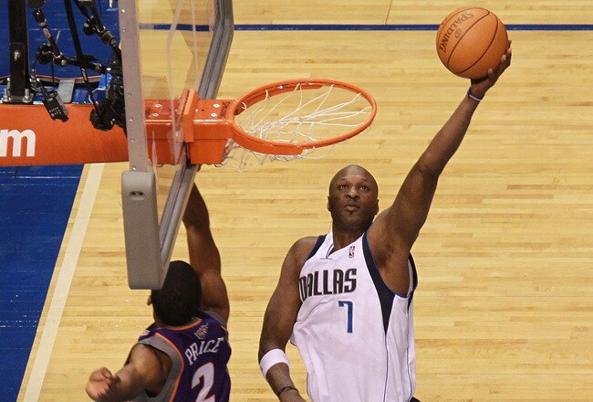 DALLAS, TX - JANUARY 04:  Lamar Odom #7 of the Dallas Mavericks takes a shot against Ronnie Price #2 of the Phoenix Suns at American Airlines Center on January 4, 2012 in Dallas, Texas.  NOTE TO USER: User expressly acknowledges and agrees that, by downloading and/or using this Photograph, user is consenting to the terms and conditions of the Getty Images License Agreement.  (Photo by Ronald Martinez/Getty Images)