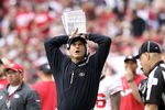 GLENDALE, AZ - DECEMBER 11:  Head coach Jim Harbaugh of the San Francisco 49ers watches from the sidelines during the NFL game against the Arizona Cardinals at the University of Phoenix Stadium on December 11, 2011 in Glendale, Arizona.  The Cardinals defeated the 49ers 21-19.  (Photo by Christian Petersen/Getty Images)