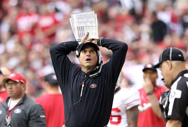 GLENDALE, AZ - DECEMBER 11:  Head coach Jim Harbaugh of the San Francisco 49ers watches from the sidelines during the NFL game against the Arizona Cardinals at the University of Phoenix Stadium on December 11, 2011 in Glendale, Arizona.  The Cardinals defeated the 49ers 21-19.  (Photo by Christian Petersen/Getty Images)