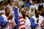 6 OCT 1992:  USA BASKETBALL TEAM MEMBERS MICHAEL JORDAN (MIDDLE) SCOTTIE PIPPEN (LEFT) AND CLIDE DREXLER (RIGHT) ACKNOWLEDGE THE CROWD AFTER RECEIVING THEIR GOLD MEDALAS MEMBERS OF THE DREAM TEAM DURING THE 1992 BARCELONA OLYMPICS IN BARCELONA, SPAIN. Man
