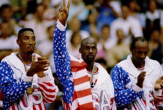 6 OCT 1992:  USA BASKETBALL TEAM MEMBERS MICHAEL JORDAN (MIDDLE) SCOTTIE PIPPEN (LEFT) AND CLIDE DREXLER (RIGHT) ACKNOWLEDGE THE CROWD AFTER RECEIVING THEIR GOLD MEDALAS MEMBERS OF THE DREAM TEAM DURING THE 1992 BARCELONA OLYMPICS IN BARCELONA, SPAIN. Man