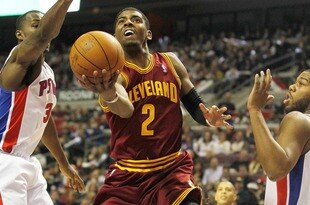 AUBURN HILLS, MI - DECEMBER 28:  Kyrie Irving #2 of the Cleveland Cavaliers gets a shot off between Rodney Stuckey #3 and Greg Monroe #10 of the Detroit Pistons on December 28, 2011 at the Palace of Auburn Hills in Auburn Hills, Michigan.  NOTE TO USER: User expressly acknowledges and agrees that, by downloading and or using this photograph, User is consenting to the terms and conditions of the Getty Images License Agreement. (Photo by Gregory Shamus/Getty Images)