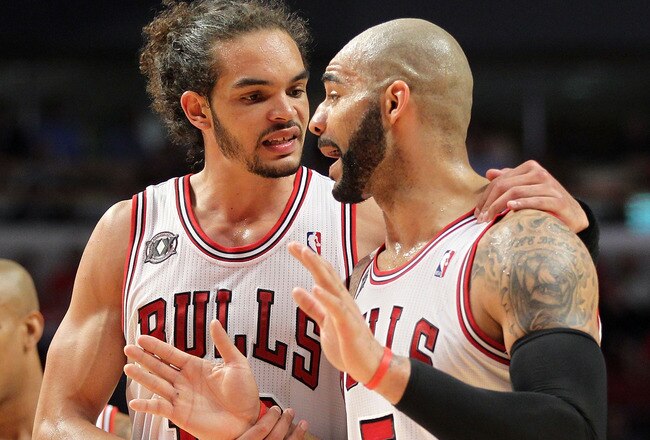 CHICAGO, IL - MAY 26:  Joakim Noah #13 and Carlos Boozer #5 of the Chicago Bulls talk on court against the Miami Heat in Game Five of the Eastern Conference Finals during the 2011 NBA Playoffs on May 26, 2011 at the United Center in Chicago, Illinois. The Heat won 83-80. NOTE TO USER: User expressly acknowledges and agrees that, by downloading and or using this photograph, User is consenting to the terms and conditions of the Getty Images License Agreement.  (Photo by Mike Ehrmann/Getty Images)