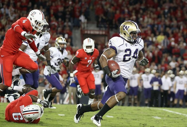 TUCSON, AZ - OCTOBER 23:  Runningback Jesse Callier #24 of the Washington Huskies rushes the football during the college football game against the Arizona Wildcats at Arizona Stadium on October 23, 2010 in Tucson, Arizona. The Wildcats defeated the Huskies 44-14.  (Photo by Christian Petersen/Getty Images)