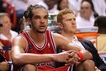 MIAMI, FL - MAY 22:  Joakim Noah #13 (L) and Brian Scalabrine #24 of the Chicago Bulls look on dejected from the bench late in the fourth quarter against the Miami Heat in Game Three of the Eastern Conference Finals during the 2011 NBA Playoffs on May 22, 2011 at American Airlines Arena in Miami, Florida.  NOTE TO USER: User expressly acknowledges and agrees that, by downloading and or using this photograph, User is consenting to the terms and conditions of the Getty Images License Agreement.  (Photo by Mike Ehrmann/Getty Images)