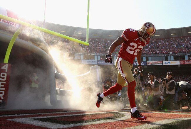 SAN FRANCISCO, CA - JANUARY 14:  Carlos Rogers #22 of the San Francisco 49ers runs out on to the field for the start of the NFC Divisional playoff game against the New Orleans Saints at Candlestick Park on January 14, 2012 in San Francisco, California.  (Photo by Ezra Shaw/Getty Images)