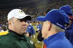 GREEN BAY, WI - JANUARY 15:  Head coach Mike McCarthy (L) of the Green Bay Packers shakes hands with head coach Tom Coughlin of the New York Giants after their game during their NFC Divisional playoff game at Lambeau Field on January 15, 2012 in Green Bay, Wisconsin.  (Photo by Jamie Squire/Getty Images)