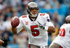 CHARLOTTE, NC - DECEMBER 24:  Josh Freeman #5 of the Tampa Bay Buccaneers drops back to pass during their game against the Carolina Panthers at Bank of America Stadium on December 24, 2011 in Charlotte, North Carolina.  (Photo by Streeter Lecka/Getty Images)