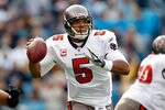 CHARLOTTE, NC - DECEMBER 24:  Josh Freeman #5 of the Tampa Bay Buccaneers drops back to pass during their game against the Carolina Panthers at Bank of America Stadium on December 24, 2011 in Charlotte, North Carolina.  (Photo by Streeter Lecka/Getty Images)