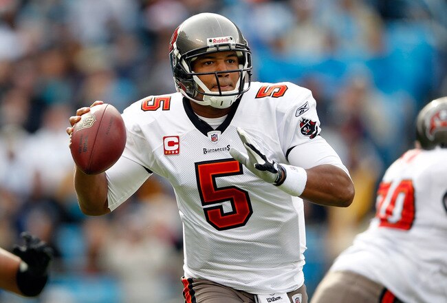 CHARLOTTE, NC - DECEMBER 24:  Josh Freeman #5 of the Tampa Bay Buccaneers drops back to pass during their game against the Carolina Panthers at Bank of America Stadium on December 24, 2011 in Charlotte, North Carolina.  (Photo by Streeter Lecka/Getty Images)