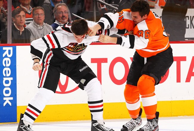 PHILADELPHIA, PA - JANUARY 05:  Andrew Shaw #65 of the Chicago Blackhawks fights Zac Rinaldo #36 of the Philadelphia Flyers during their game on January 5, 2012 at The Wells Fargo Center in Philadelphia, Pennsylvania.  (Photo by Al Bello/Getty Images)