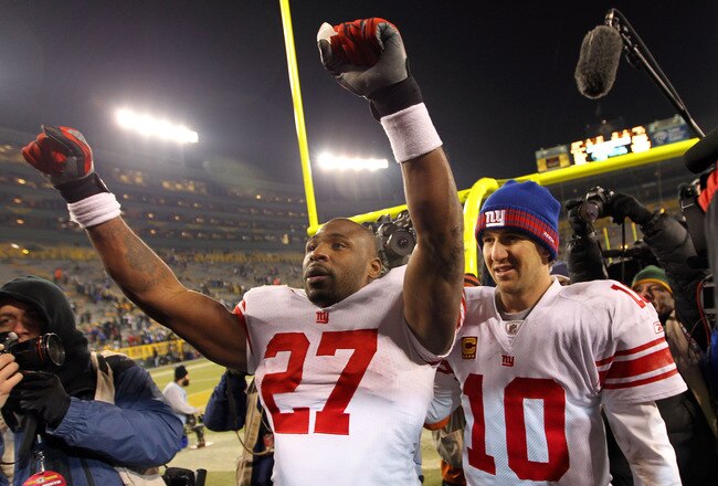 GREEN BAY, WI - JANUARY 15:  Eli Manning #10 of the New York Giants celebrates with teammatee  Brandon Jacobs #27 after defeating the Green Bay Packers during their NFC Divisional playoff game at Lambeau Field on January 15, 2012 in Green Bay, Wisconsin.  (Photo by Jamie Squire/Getty Images)