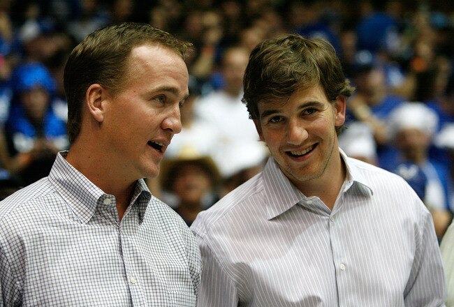 DURHAM, NC - MARCH 08:  Peyton Manning (L) and brother Eli Manning (R) watch on at the Duke Blue Devils versus North Carolina Tar Heels during their game at Cameron Indoor Stadium on March 8, 2008 in Durham, North Carolina.  (Photo by Streeter Lecka/Getty Images)