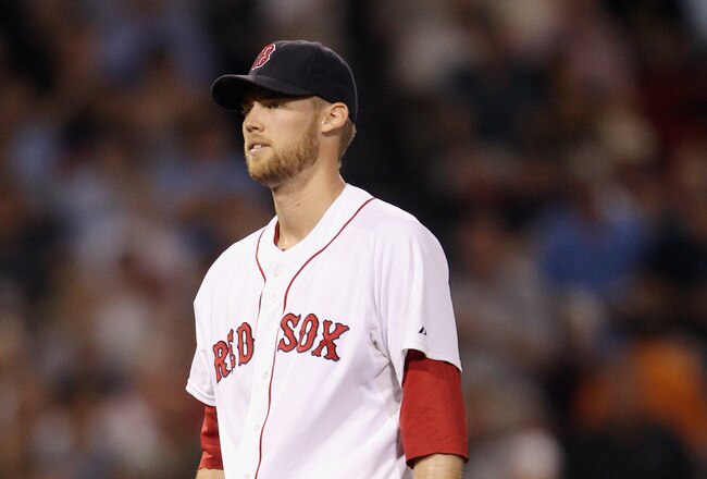 BOSTON, MA - AUGUST 01:  Daniel Bard #51 of the Boston Red Sox reacts after a hit by Asdrubal Cabrera of the Cleveland Indians is ruled a two run homer in the eighth inning on August 1, 2011 at Fenway Park in Boston, Massachusetts.  (Photo by Elsa/Getty Images)