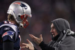 FOXBORO, MA - JANUARY 14: (L-R)  Tom Brady #12 of the New England Patriots talks with head coach Bill Belichick on the sideline against the Denver Broncos during their AFC Divisional Playoff Game at Gillette Stadium on January 14, 2012 in Foxboro, Massachusetts.  (Photo by Elsa/Getty Images)