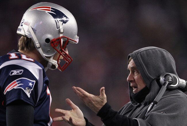 FOXBORO, MA - JANUARY 14: (L-R)  Tom Brady #12 of the New England Patriots talks with head coach Bill Belichick on the sideline against the Denver Broncos during their AFC Divisional Playoff Game at Gillette Stadium on January 14, 2012 in Foxboro, Massachusetts.  (Photo by Elsa/Getty Images)
