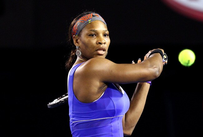 MELBOURNE, AUSTRALIA - JANUARY 17:  Serena Williams of the USA plays a backhand in her first round match against Tamira Paszek of Austria during day two of the 2012 Australian Open at Melbourne Park on January 17, 2012 in Melbourne, Australia.  (Photo by Ryan Pierse/Getty Images)