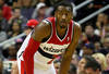 WASHINGTON, DC - JANUARY 06:  John Wall #2 of the Washington Wizards looks on against the New York Knicks during the second half at Verizon Center on January 6, 2012 in Washington, DC.  NOTE TO USER: User expressly acknowledges and agrees that, by downloading and or using this photograph, User is consenting to the terms and conditions of the Getty Images License Agreement.  (Photo by Rob Carr/Getty Images)