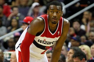 WASHINGTON, DC - JANUARY 06:  John Wall #2 of the Washington Wizards looks on against the New York Knicks during the second half at Verizon Center on January 6, 2012 in Washington, DC.  NOTE TO USER: User expressly acknowledges and agrees that, by downloading and or using this photograph, User is consenting to the terms and conditions of the Getty Images License Agreement.  (Photo by Rob Carr/Getty Images)