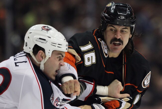 ANAHEIM, CA - JANUARY 07:  George Parros #16 of the Anaheim Ducks throws a punch at Jared Boll #40 of the Columbus Blue Jackets in the first period at the Honda Center on January 7, 2011 in Anaheim, California.  (Photo by Jeff Gross/Getty Images)
