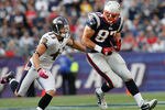 FOXBORO, MA - OCTOBER 17:  Rob Gronkowski #87 of the New England Patriots gains yards as he is chased by Haruki Nakamura #43 of the Baltimore Ravens at Gillette Stadium on October 17, 2010 in Foxboro, Massachusetts. (Photo by Jim Rogash/Getty Images)