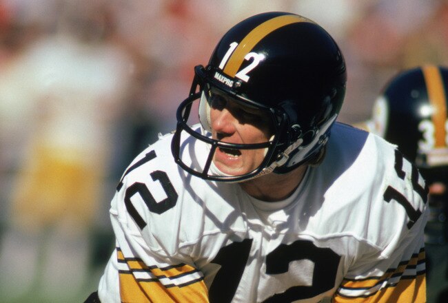 ATLANTA - NOVEMBER 1:  Quarterback Terry Bradshaw #12 of the Pittsburgh Steelers calls the play during the game against the Atlanta Falcons at Fulton County Stadium on November 1, 1981 in Atlanta, Georgia. The Steelers defeated the Falcons 34-20.  (Photo by: Scott Cunningham/Getty Images).