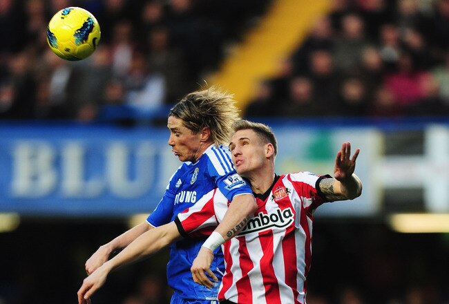 LONDON, ENGLAND - JANUARY 14:  Matthew Kilgallon of Sunderland jumps with Fernando Torres of Chelsea during the Barclays Premier League match between Chelsea and Sunderland at Stamford Bridge on January 14, 2012 in London, England.  (Photo by Mike Hewitt/Getty Images)
