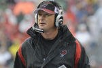 TAMPA, FL - NOVEMBER 30:  Coach Jon Gruden of the Tampa Bay Buccaneers checks the scoreboard against the New Orleans Saints at Raymond James Stadium on November 30, 2008 in Tampa, Florida.  (Photo by Al Messerschmidt/Getty Images)