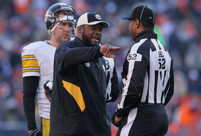 DENVER, CO - JANUARY 08:  Head coach Mike Tomlin of the Pittsburgh Steelers talks with a referee during the AFC Wild Card Playoff game against the Denver Broncos at Sports Authority Field at Mile High on January 8, 2012 in Denver, Colorado.  (Photo by Jeff Gross/Getty Images)