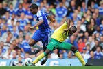 LONDON, ENGLAND - AUGUST 27:  Florent Malouda of Chelsea is tackled by Leon Barnett of Norwich City  during the Barclays Premier League match between Chelsea and Norwich City at Stamford Bridge on August 27, 2011 in London, England.  (Photo by Shaun Botterill/Getty Images)