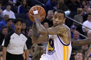 OAKLAND, CA - MARCH 25: Monta Ellis #8 of the Golden State Warriors drives to the basket against the Toronto Raptors at Oracle Arena on March 25, 2011 in Oakland, California. NOTE TO USER: User expressly acknowledges and agrees that, by downloading and or using this photograph, User is consenting to the terms and conditions of the Getty Images License Agreement.  (Photo by Ezra Shaw/Getty Images)
