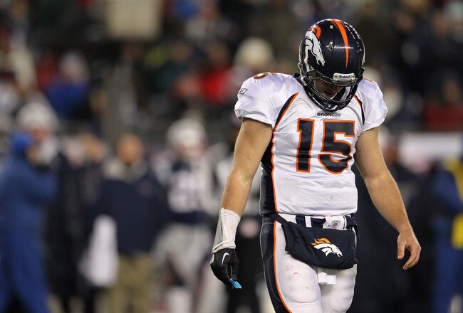 FOXBORO, MA - JANUARY 14:  Tim Tebow #15 of the Denver Broncos walks towards the sideline with his head down in the second half against the New England Patriots during their AFC Divisional Playoff Game at Gillette Stadium on January 14, 2012 in Foxboro, Massachusetts.  (Photo by Jim Rogash/Getty Images)