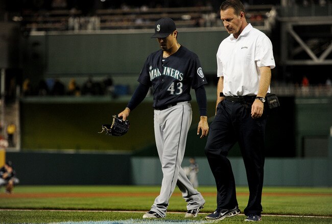 WASHINGTON, DC - JUNE 21: Pitcher Brandon League #43 of the Seattle Mariners is relieved after being hit against the Washington Nationals in the bottom of the ninth inning at Nationals Park on June 21, 2011 in Washington, DC. The Nationals won, 6-5, on a Wilson Ramos three run homer. (Photo by Patrick Smith/Getty Images)