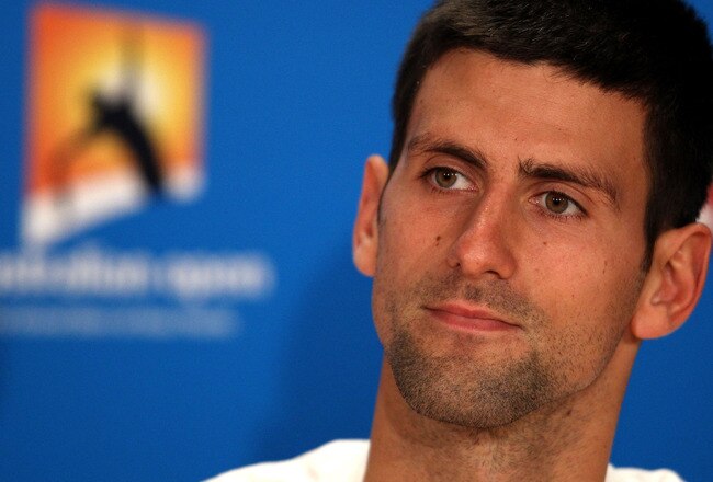 MELBOURNE, AUSTRALIA - JANUARY 17:  Novak Djokovic of Serbia speaks to the media after winning his first round match against Paolo Lorenzi of Italy during day two of the 2012 Australian Open at Melbourne Park on January 17, 2012 in Melbourne, Australia.  (Photo by Scott Barbour/Getty Images)