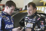 DAYTONA BEACH, FL - JANUARY 13:  Carl Edwards (L), driver of the #99 Fastenal Ford, talks with Ryan Newman, driver of the #39 U.S. Army Chevrolet, during Daytona Preseason Thunder at Daytona International Speedway on January 13, 2012 in Daytona Beach, Florida.  (Photo by Jerry Markland/Getty Images for NASCAR)