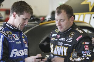 DAYTONA BEACH, FL - JANUARY 13:  Carl Edwards (L), driver of the #99 Fastenal Ford, talks with Ryan Newman, driver of the #39 U.S. Army Chevrolet, during Daytona Preseason Thunder at Daytona International Speedway on January 13, 2012 in Daytona Beach, Florida.  (Photo by Jerry Markland/Getty Images for NASCAR)