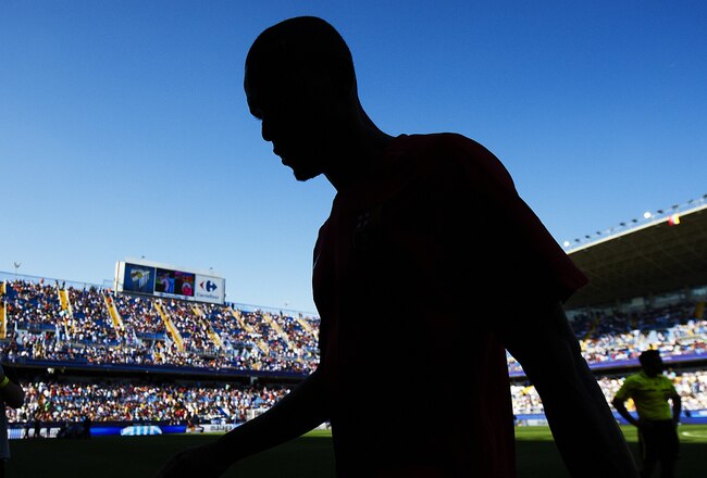 MALAGA, VALENCIA - MAY 21:  Eric Abidal of Barcelona trudges off the pitch during the La Liga match between Malaga and Barcelona at La Rosaleda Stadium on May 21, 2011 in Malaga, Spain. Barcelona won 3-1.  (Photo by Manuel Queimadelos Alonso/Getty Images)